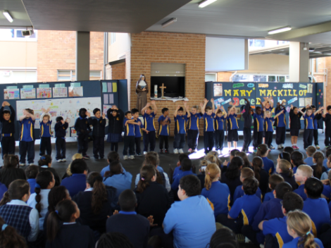 Kindergarten students at Our Lady of the Rosary Primary performed the gathering song, A Cross of Stars