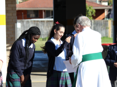 Students receive their Patrician Cross