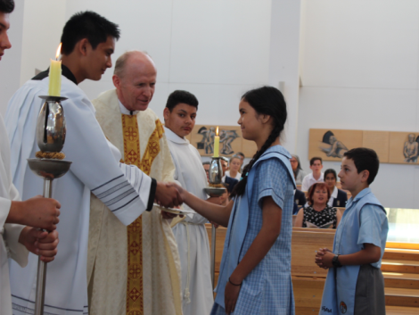 Fr Paul and concelebrants thanking students at World Mission Mass