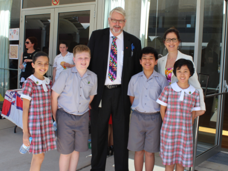 Greg Whitby with student representatives and Principal from St Patrick