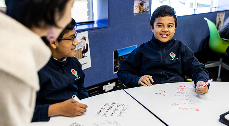 Junior Delany Catholic College Granville students receiving assistance from our Dedicated Teachers
