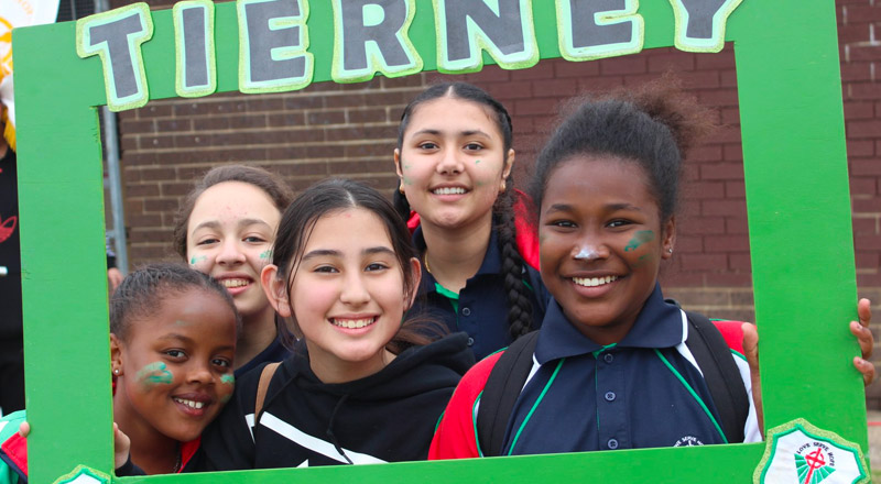 Happy students cheering for their House at Delany Catholic College Granville