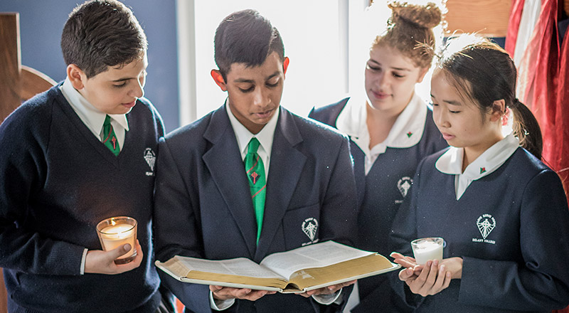Delany Catholic College Granville students practising their faith and reading from the Bible