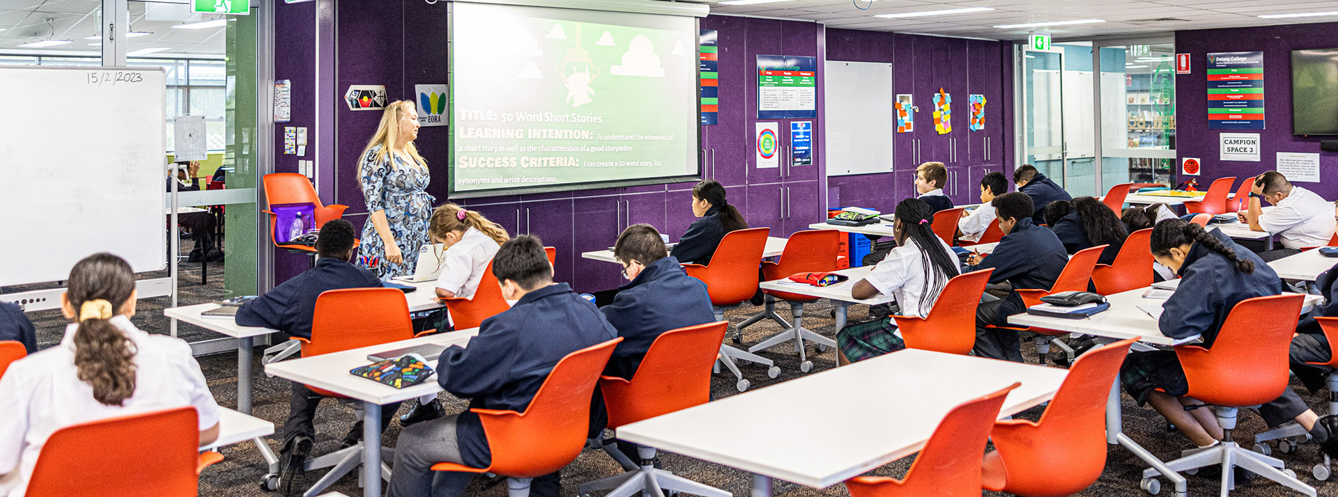 Teacher with class at Delany Catholic College Granville