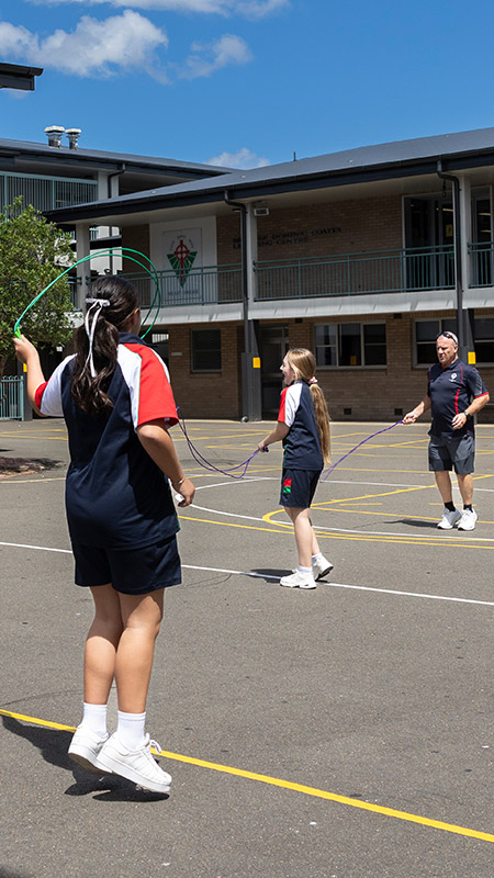 Delany Granville students in sports polos playing skip rope