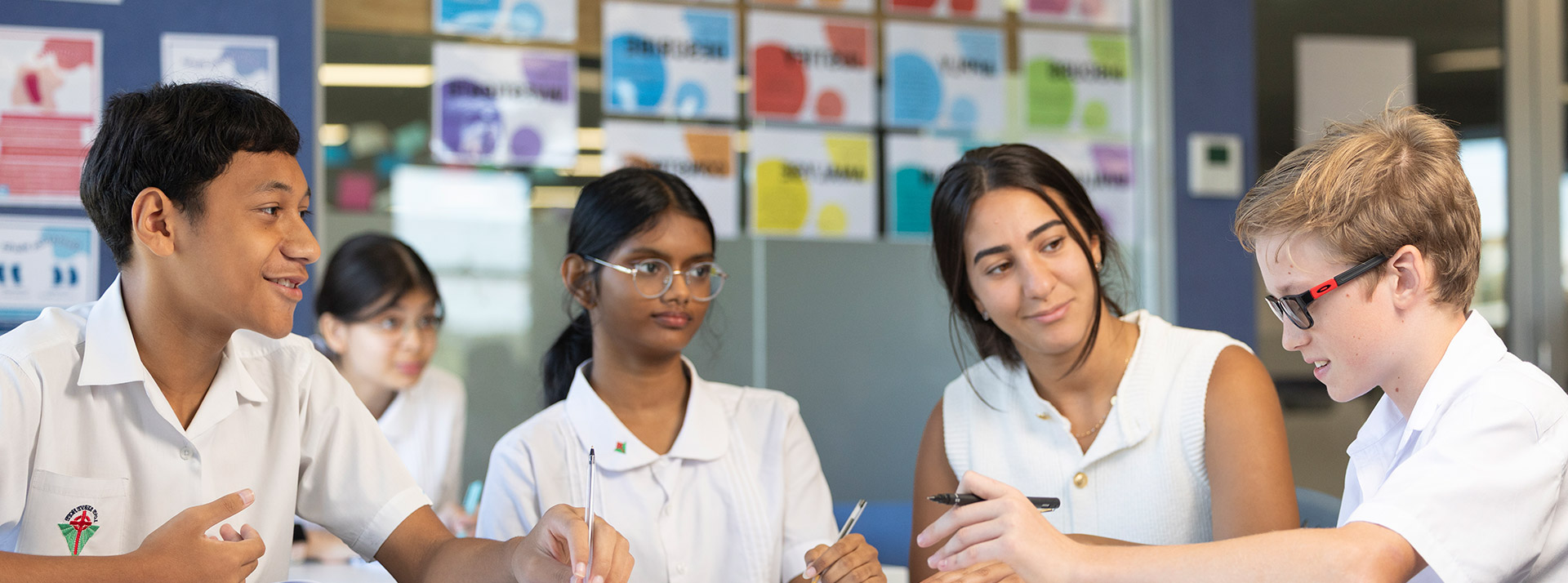 Dedicated Delany Granville teacher assisting students in class