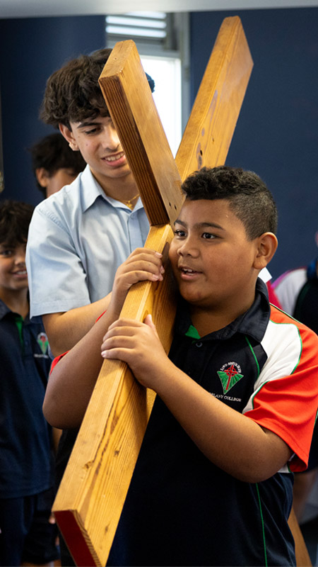 Delany Granville students carrying the cross
