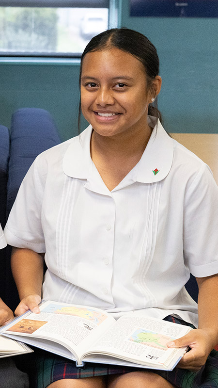 Happy Delany Granville student in library