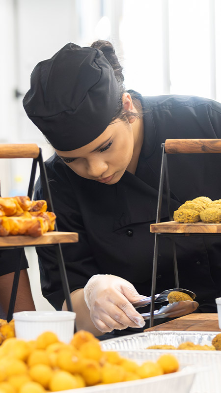 Hospitality Food Tech students preparing finger food