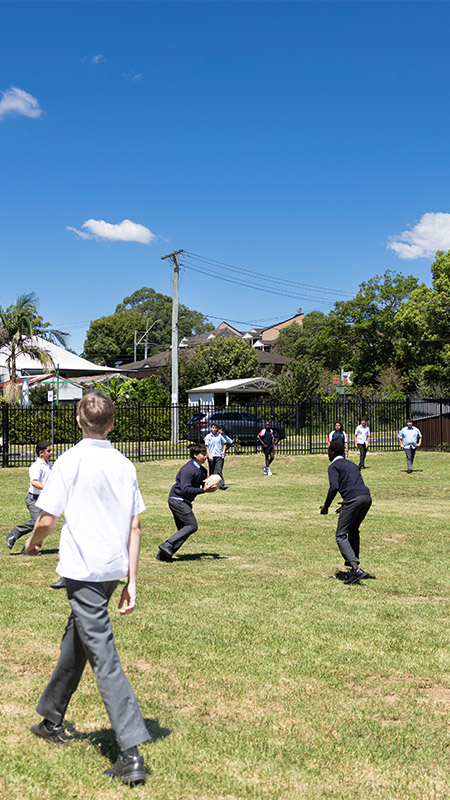 Delany Catholic College Granville students playing football on outdoor field