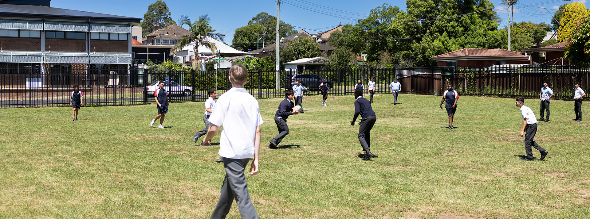 Delany Catholic College Granville students playing football on outdoor field