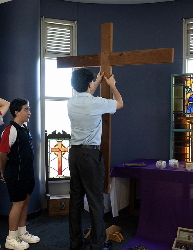 Delany Granville student holding cross
