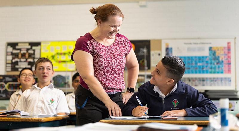 Teacher assisting Delany Granville student in class