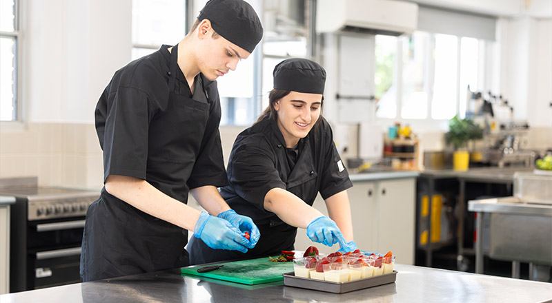 Hospitality slash Food Tech students preparing dessert