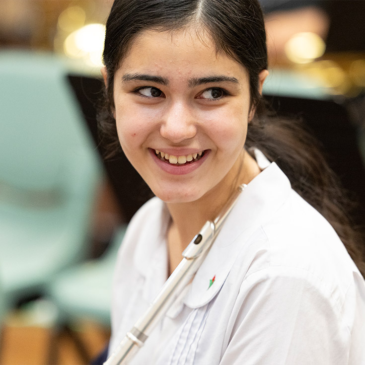 Smiling Delany College Granville student in class