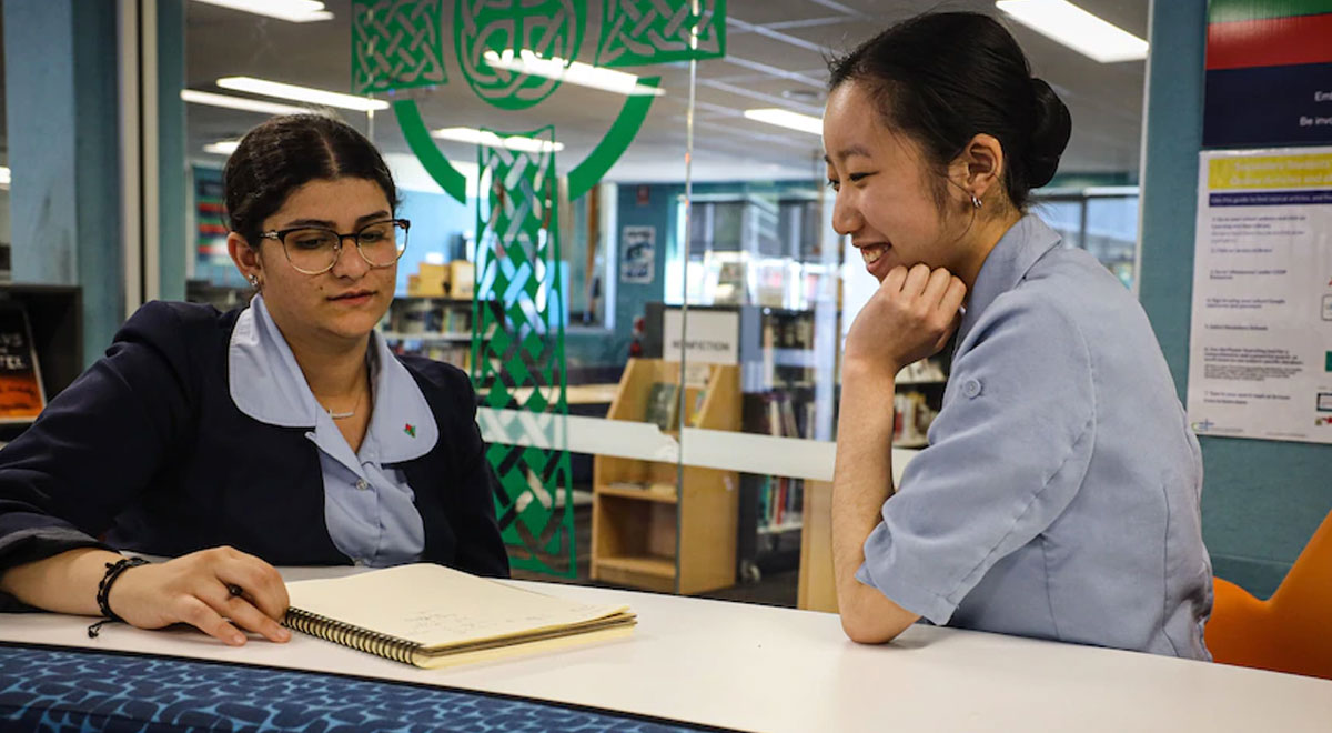 Yuqing Li (right) is also looking forward to working in the classroom next year.(ABC News: Tim Swanston)